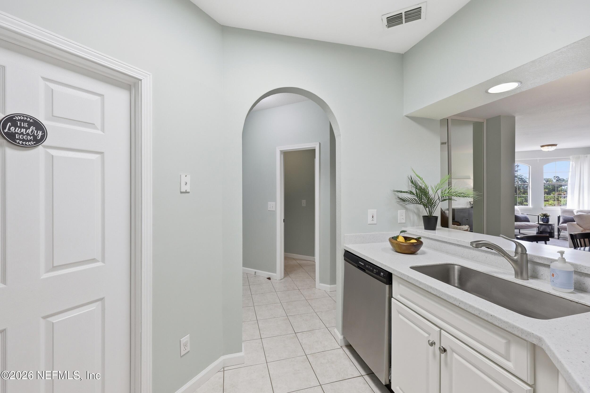1529 Vista Cove Road St. Augustine, FL 32084 - Photo 10 of 75 a bathroom with a sink and a mirror