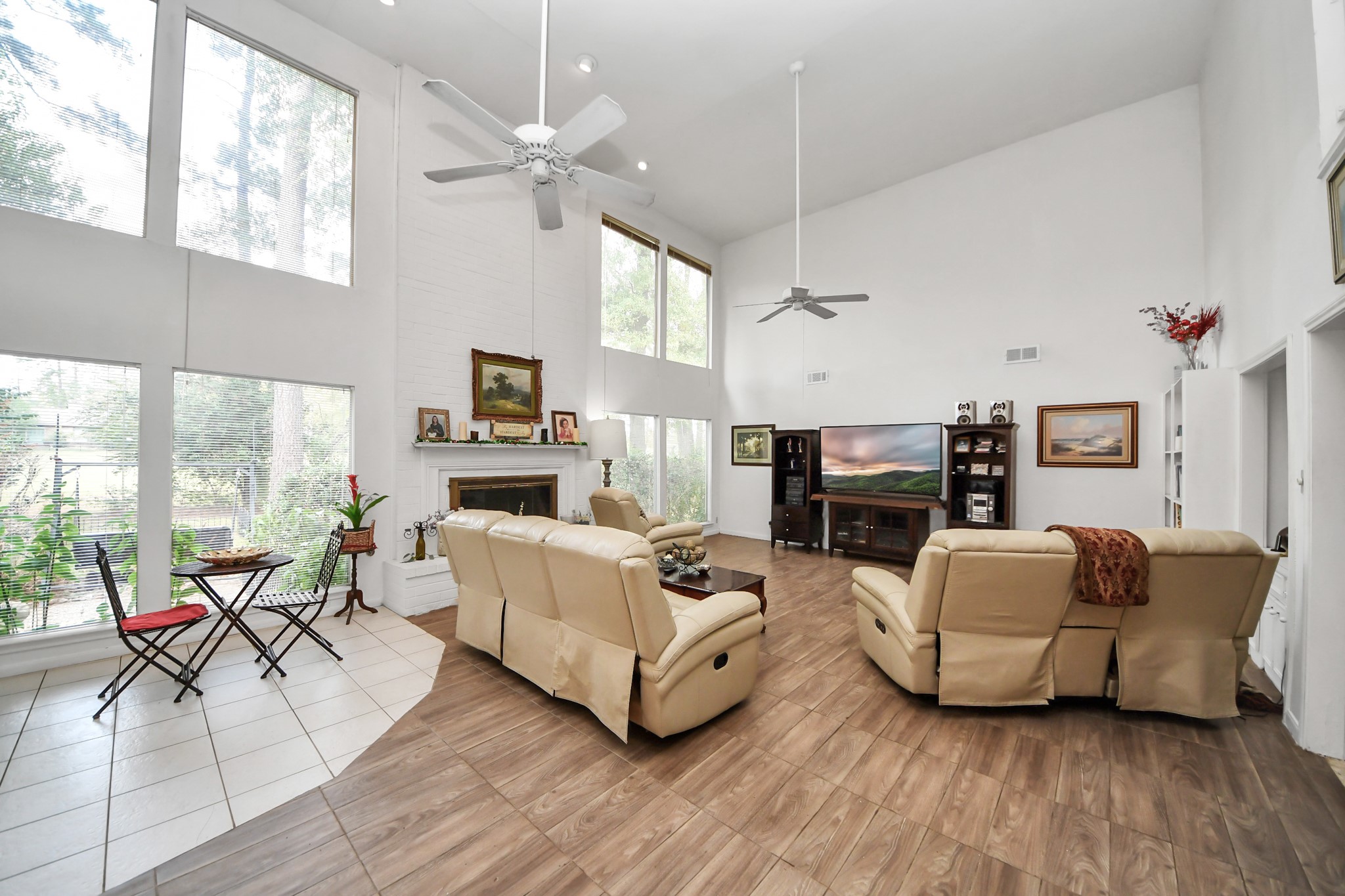 17 Winged Foot Drive Conroe, TX 77304 - Photo 12 of 46 a living room with fireplace furniture and a large window