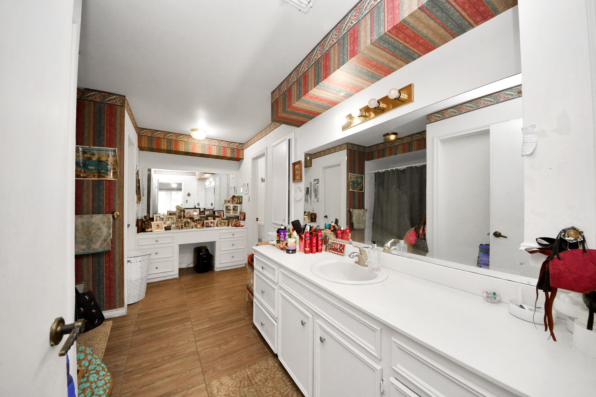 17 Winged Foot Drive Conroe, TX 77304 - Photo 15 of 46 a kitchen with a sink stove and cabinets