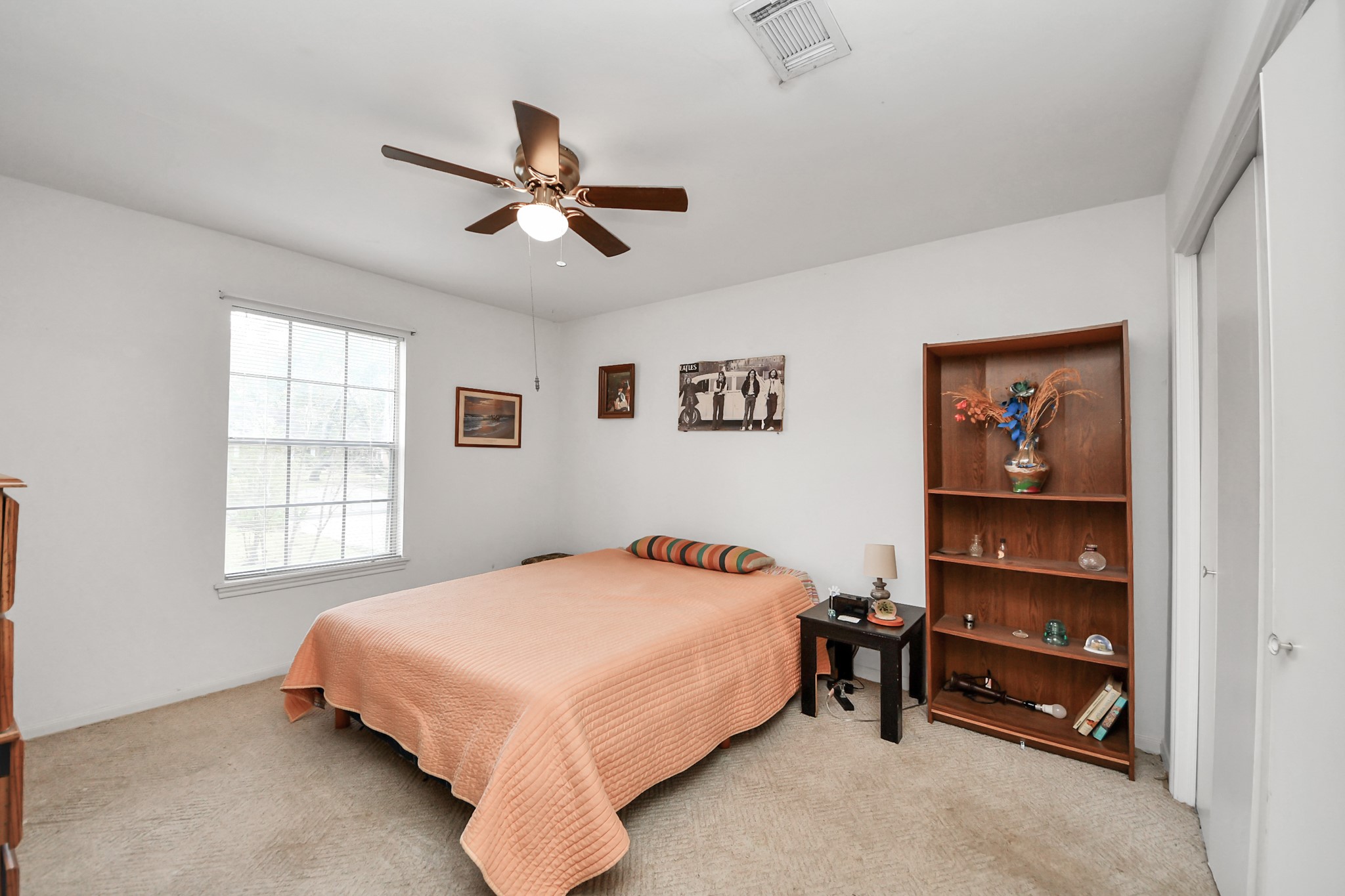 17 Winged Foot Drive Conroe, TX 77304 - Photo 21 of 46 a bedroom with a bed and a window