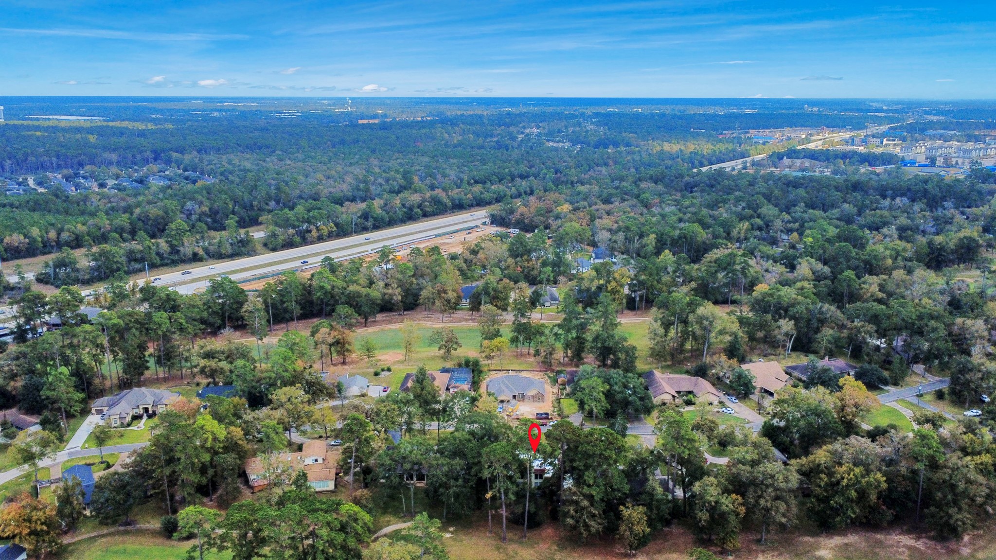 17 Winged Foot Drive Conroe, TX 77304 - Photo 4 of 46 a view of a city with mountains in the background
