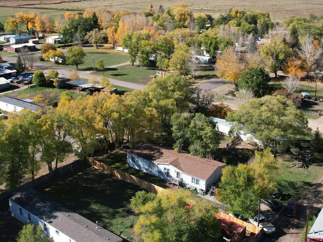 an aerial view of residential houses with outdoor space