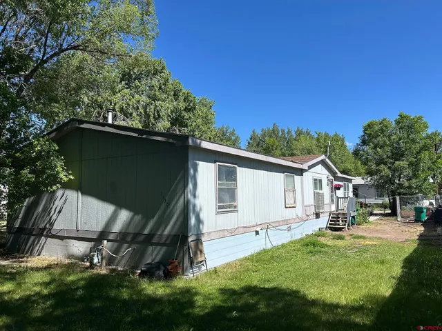 a view of a back yard of the house
