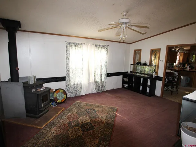 a view of a livingroom with furniture and a window