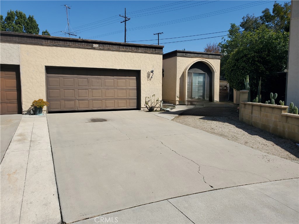 8245 Big Bear Circle Buena Park, CA 90621 - Photo 2 of 23 a view of entrance gate of house and car parked