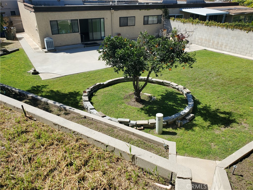 8245 Big Bear Circle Buena Park, CA 90621 - Photo 21 of 23 a view of a house with a yard