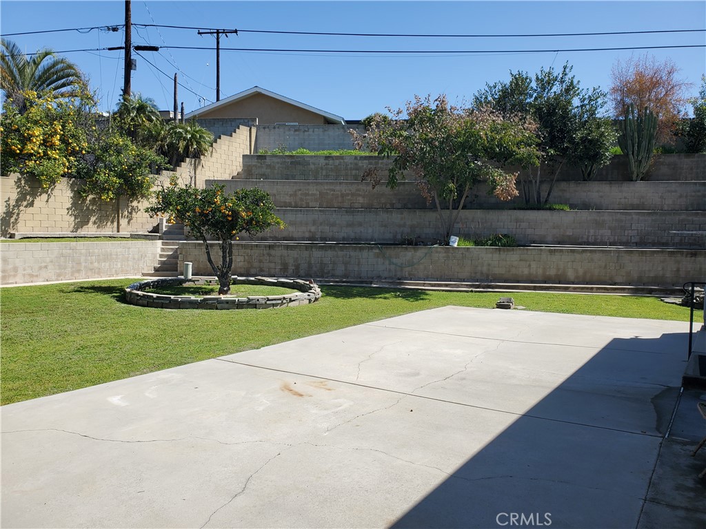8245 Big Bear Circle Buena Park, CA 90621 - Photo 4 of 23 a view of a swimming pool with a yard