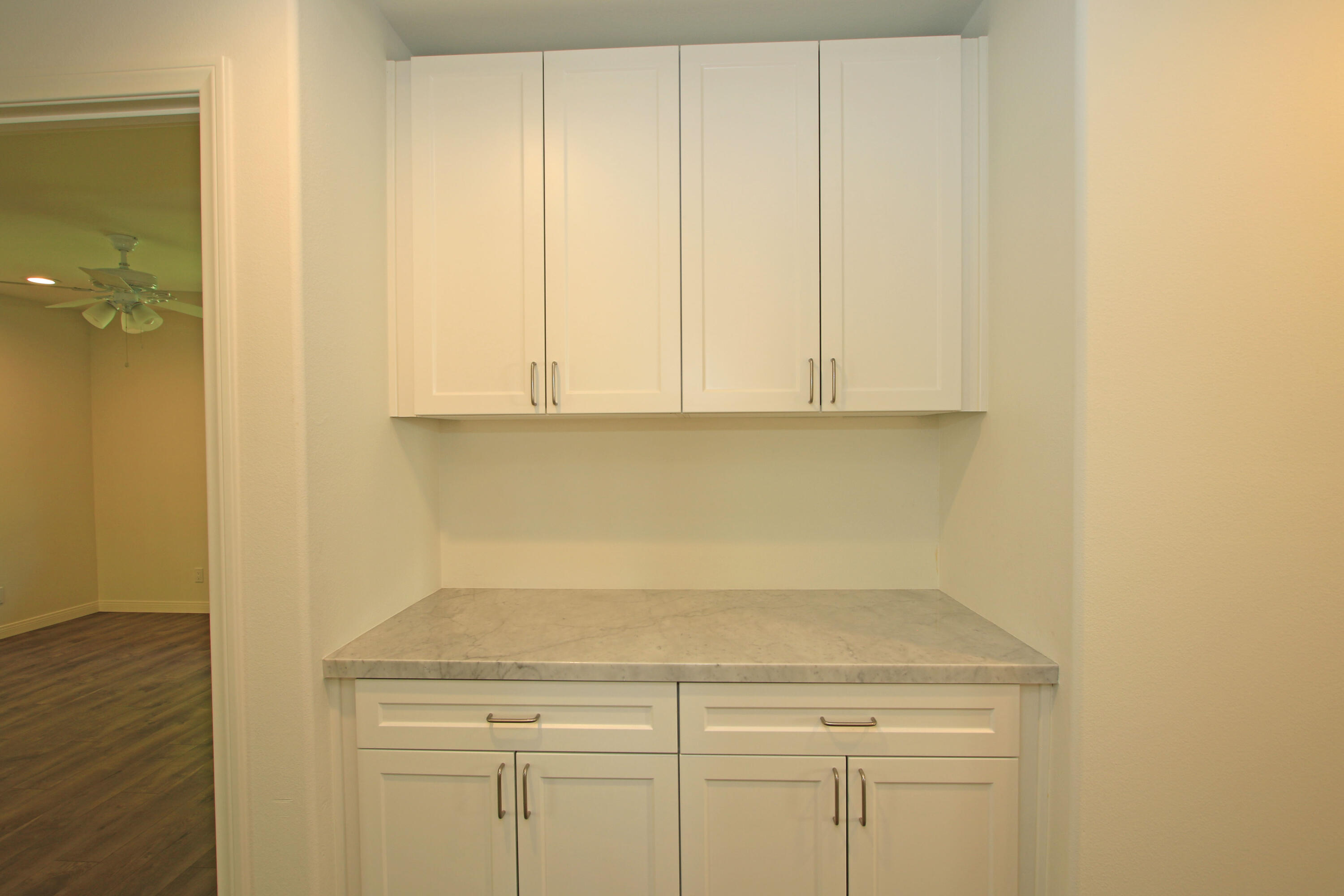 51845 Eisenhower Drive La Quinta, CA 92253 - Photo 20 of 35 a view of a storage and utility room with cabinet