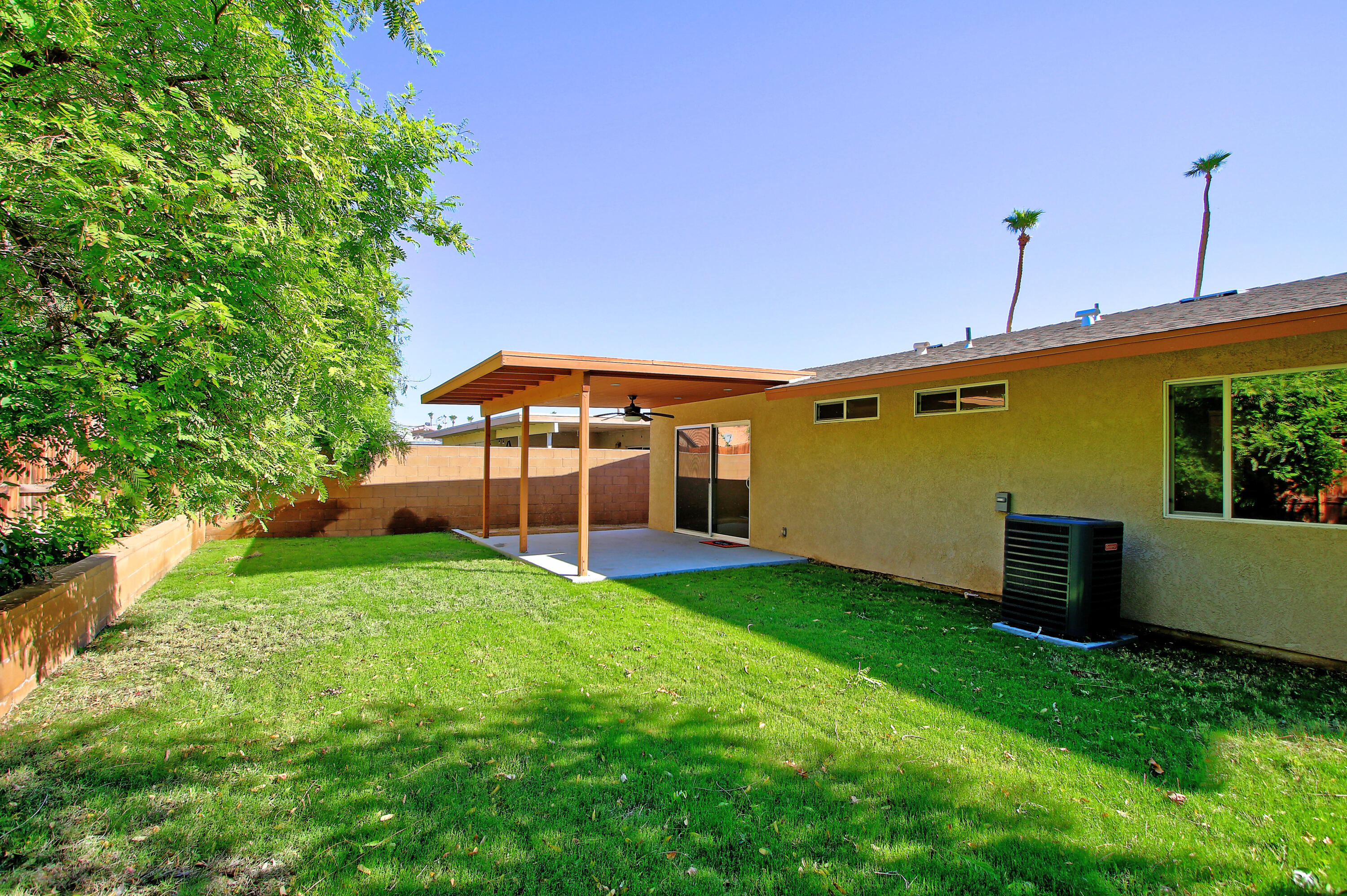51845 Eisenhower Drive La Quinta, CA 92253 - Photo 28 of 35 a view of a backyard with a garden