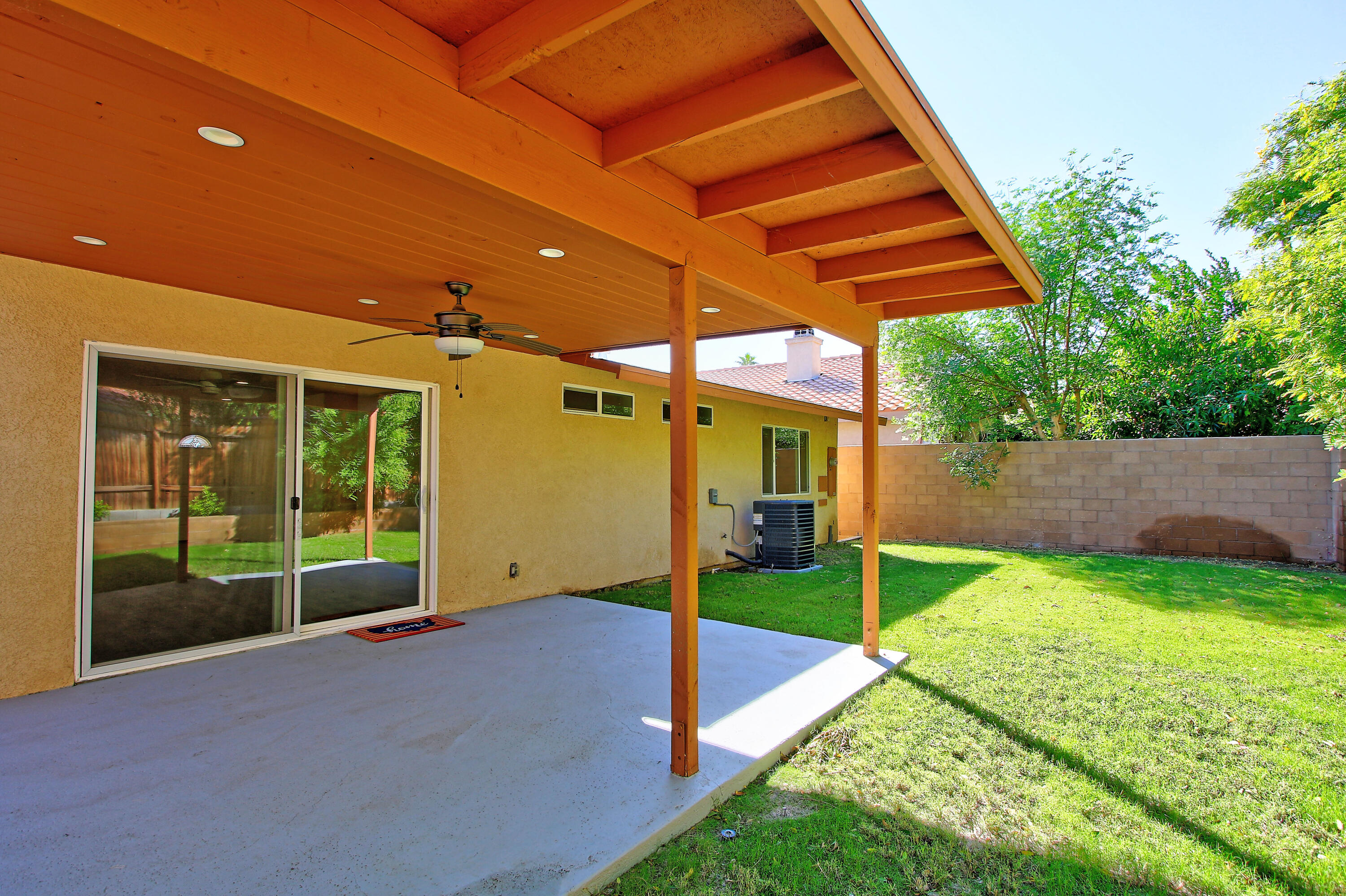 51845 Eisenhower Drive La Quinta, CA 92253 - Photo 29 of 35 a view of a house with backyard and porch