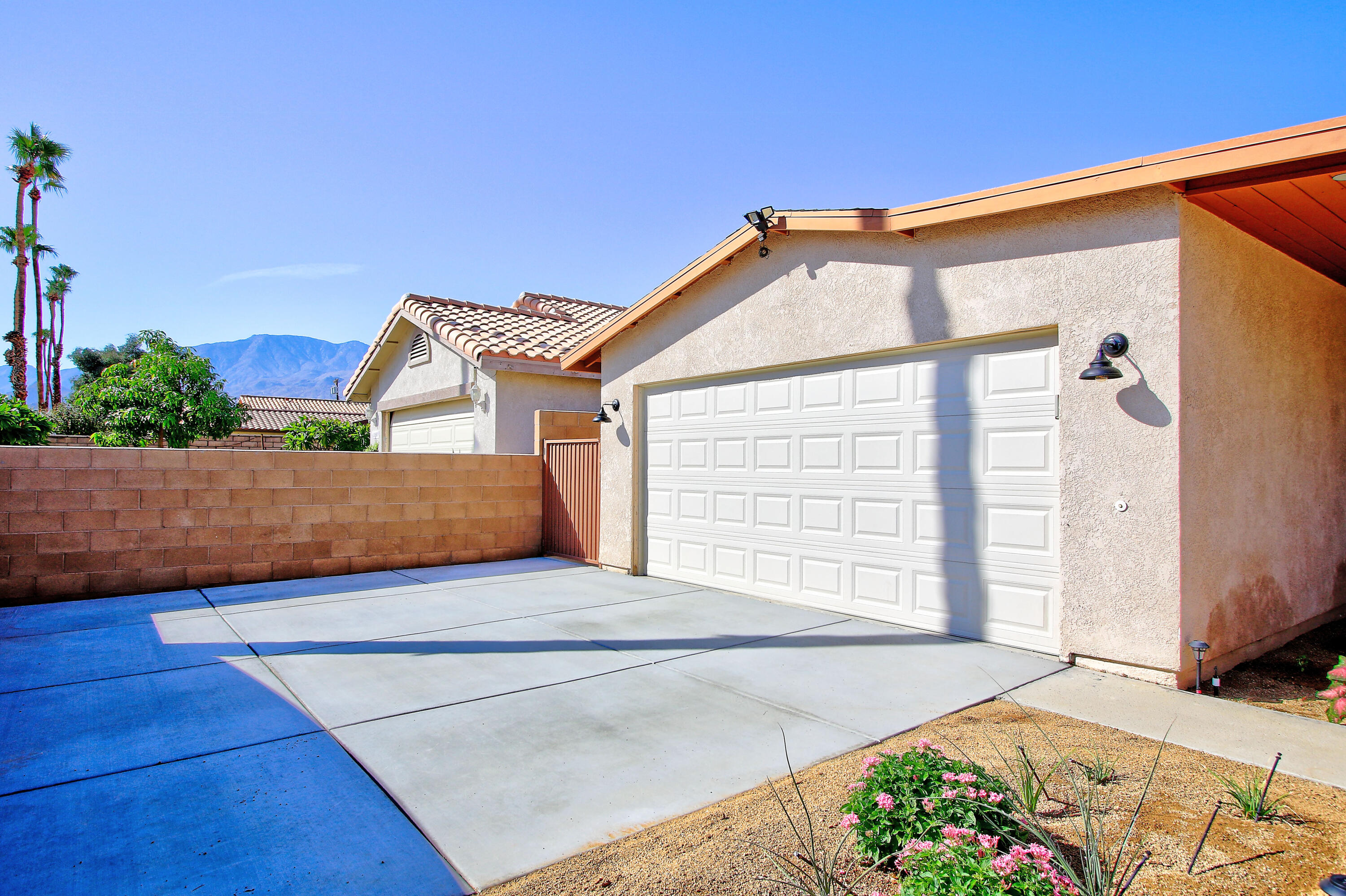 51845 Eisenhower Drive La Quinta, CA 92253 - Photo 3 of 35 a view of a house with a yard