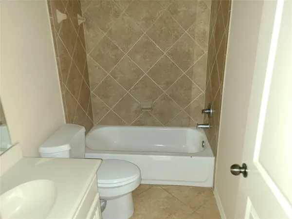 a bathroom with a toilet and a bathtub