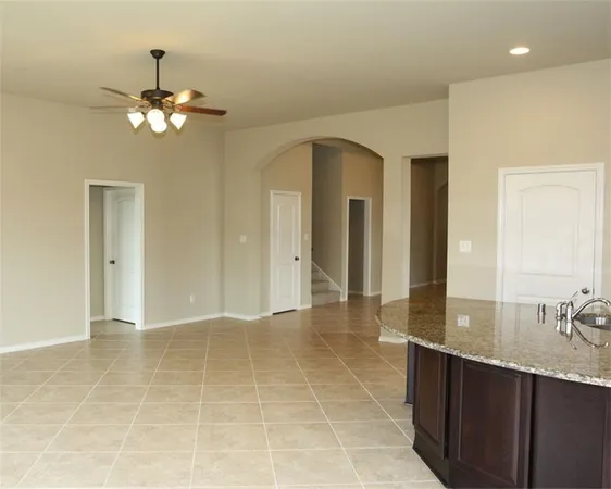 a view of an empty room with a bathroom