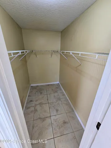 a view of a room with racks on the wall