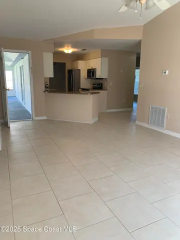 a view of a kitchen with a sink