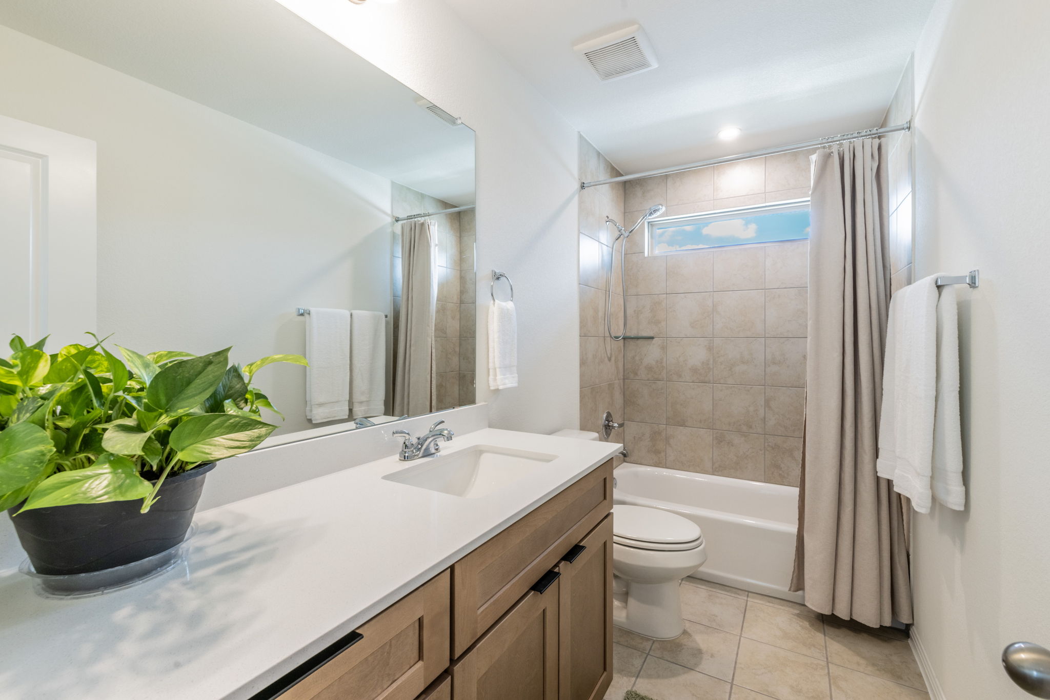593 Backstays Loop Kyle, TX 78640 - Photo 14 of 26 a bathroom with a granite countertop sink a toilet and shower