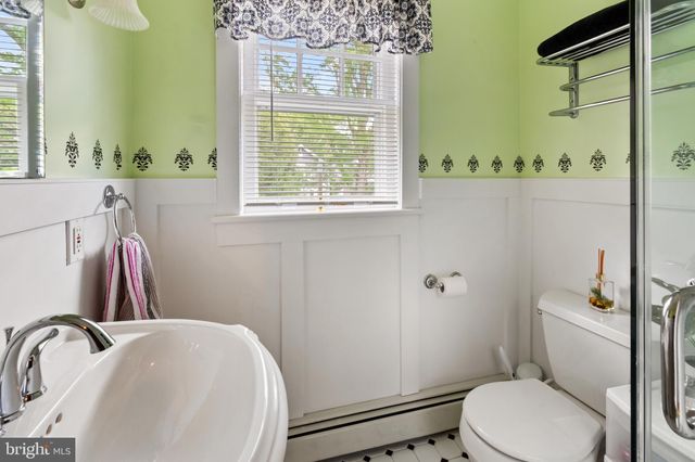 a bathroom with a sink a toilet and tub