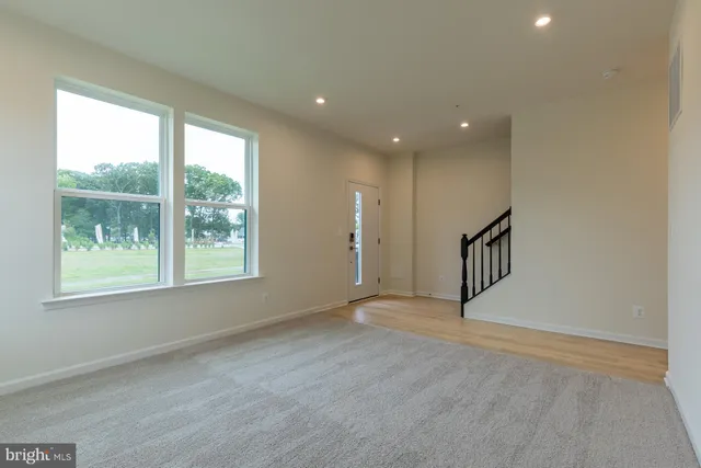 a bathroom with a toilet sink and a mirror