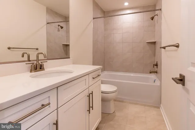 an empty room with closet and wooden floor