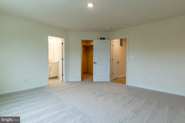 a view of a brick building next to a yard