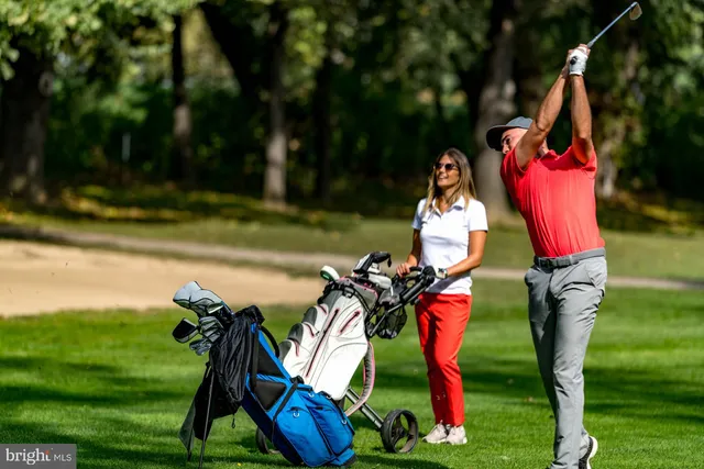 a view of living room with furniture and wooden floor