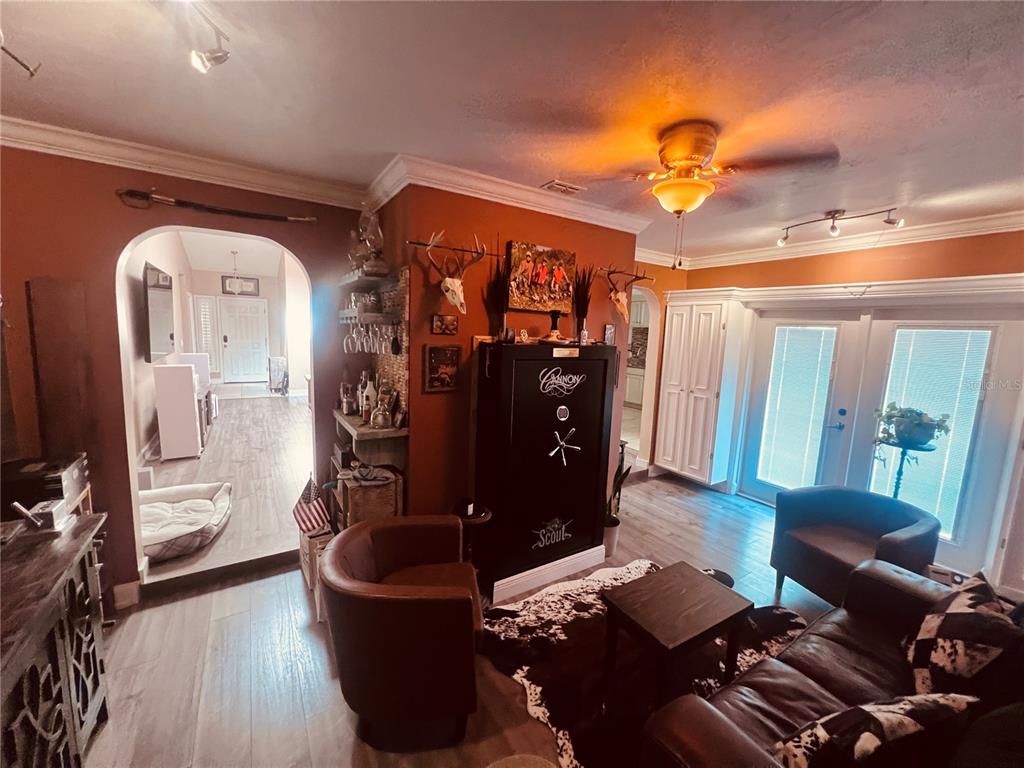 357 Tymber Run Ormond Beach, FL 32174 - Photo 16 of 32 a living room with furniture and wooden floor