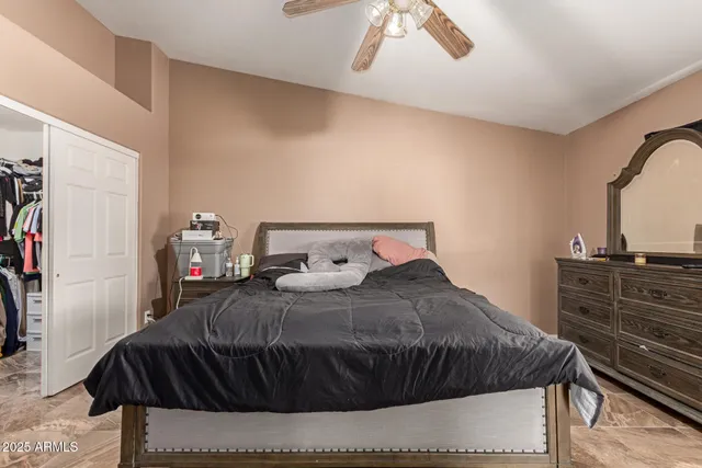 a bedroom with a bed and a dresser