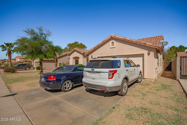 a view of a car in front of a house