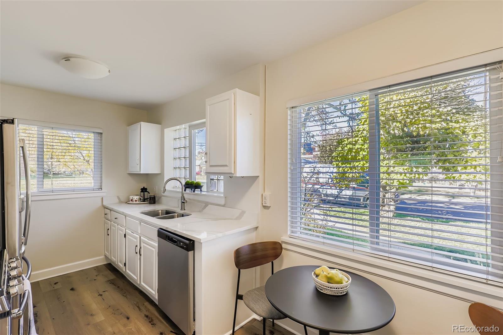 3600 East 30th Avenue Denver, CO 80205 - Photo 11 of 29 a kitchen with a sink and a window