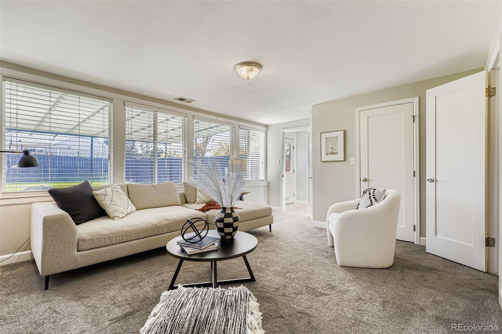 3600 East 30th Avenue Denver, CO 80205 - Photo 13 of 29 a living room with furniture and a large window