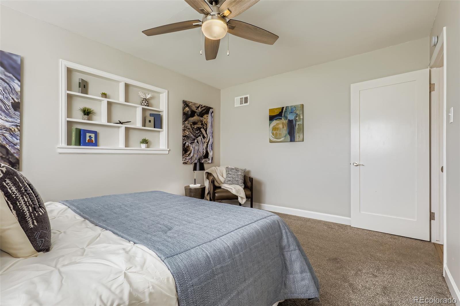 3600 East 30th Avenue Denver, CO 80205 - Photo 15 of 29 a bedroom with a large bed and a window