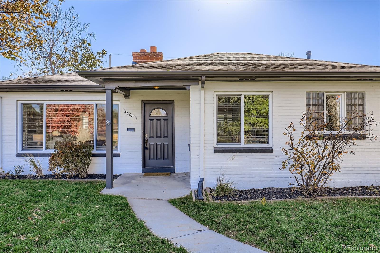 3600 East 30th Avenue Denver, CO 80205 - Photo 2 of 29 a front view of a house with a yard