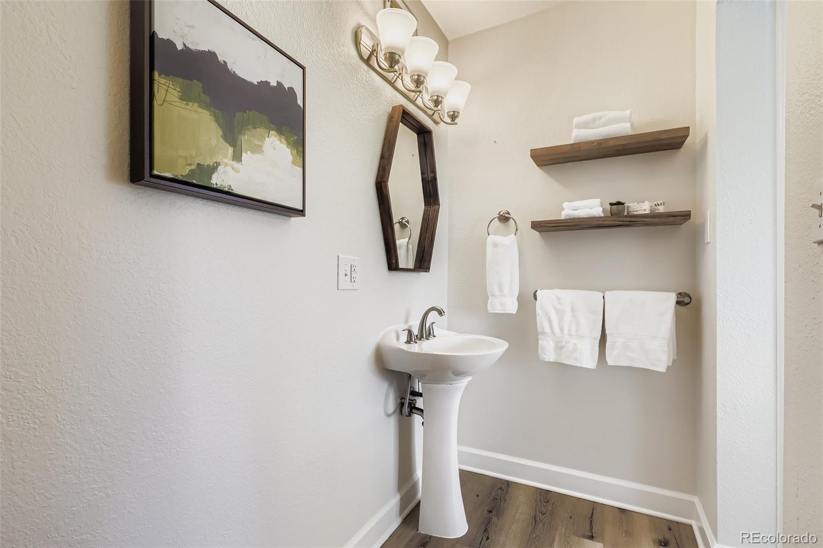3600 East 30th Avenue Denver, CO 80205 - Photo 21 of 29 a bathroom with a sink and a mirror