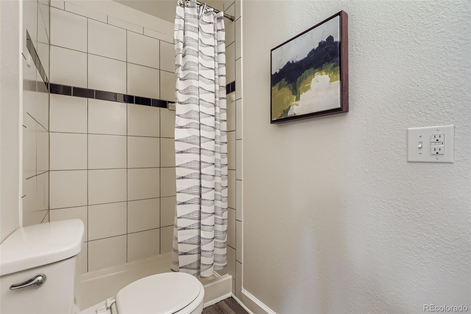 3600 East 30th Avenue Denver, CO 80205 - Photo 22 of 29 a bathroom with a toilet and a shower