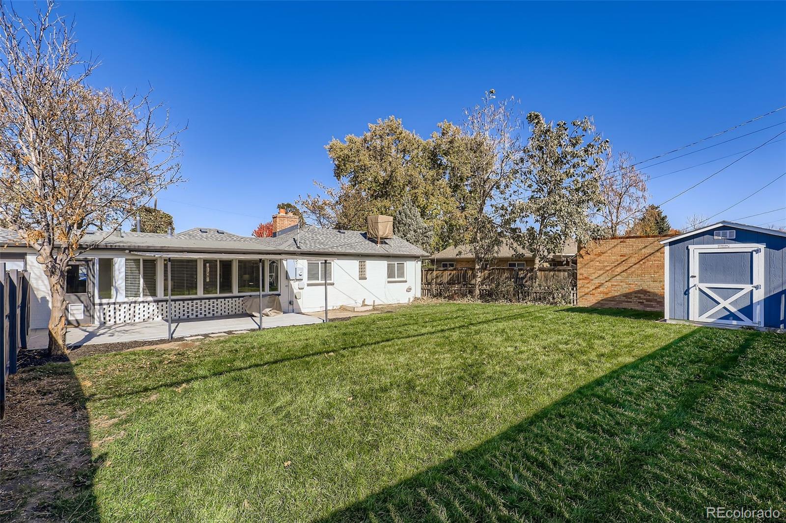 3600 East 30th Avenue Denver, CO 80205 - Photo 26 of 29 a front view of a house with a garden