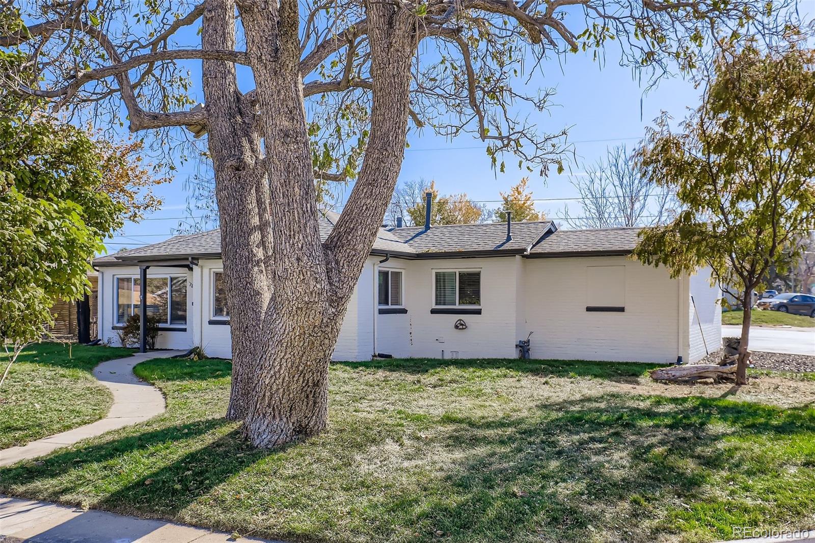 3600 East 30th Avenue Denver, CO 80205 - Photo 29 of 29 a front view of house with yard and trees