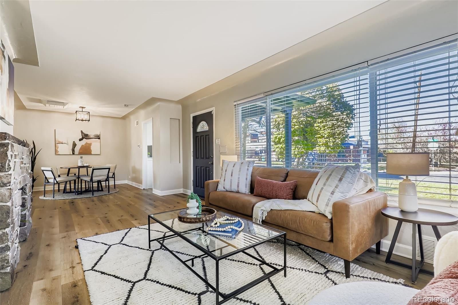 3600 East 30th Avenue Denver, CO 80205 - Photo 3 of 29 a living room with furniture and a table