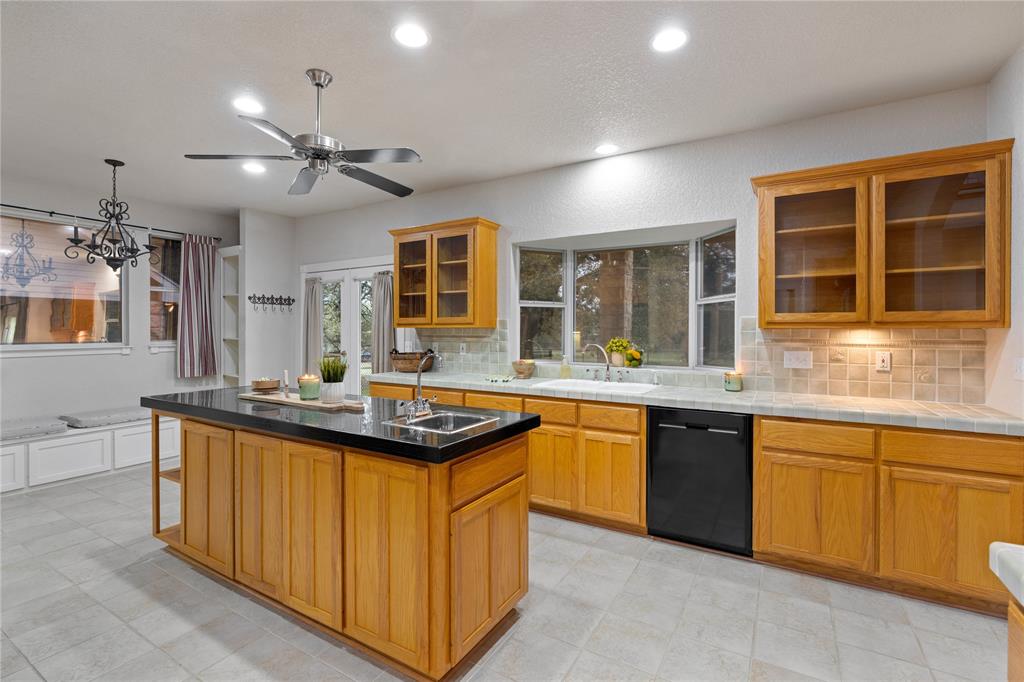 400 Indian Hills Road Gatesville, TX 76528 - Photo 12 of 38 a kitchen with stainless steel appliances granite countertop a sink and cabinets