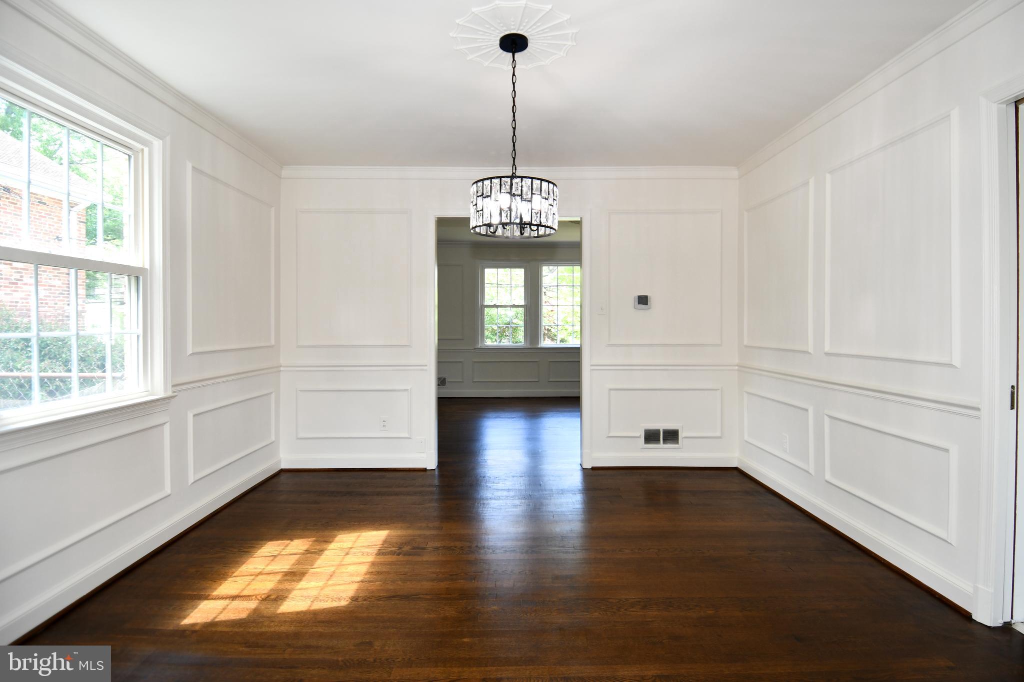 7109 Radnor Road Bethesda, MD 20817 - Photo 11 of 82 DINING ROOM HAS WAINSCOTING AND NEW CHANDELIER