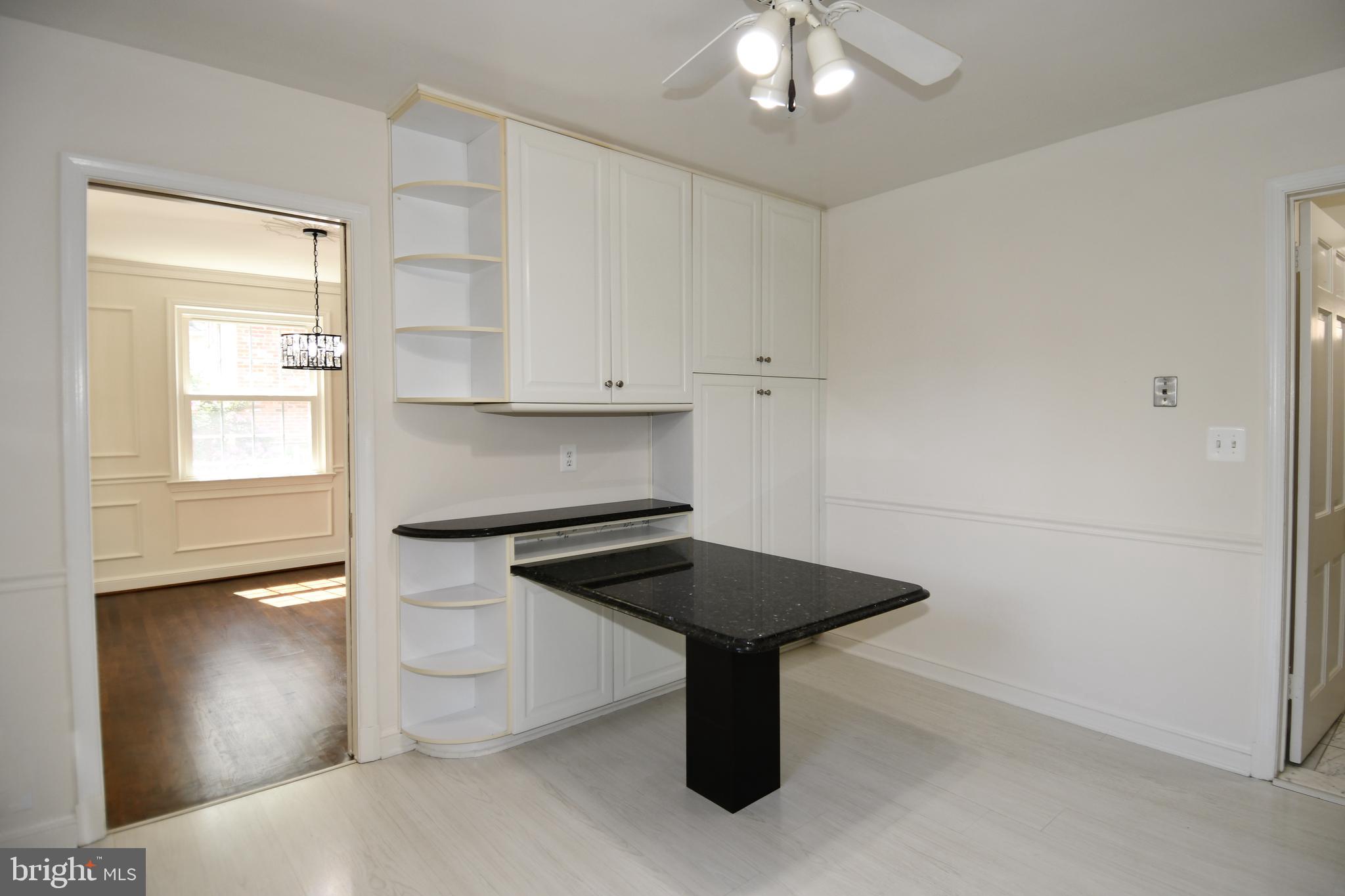 7109 Radnor Road Bethesda, MD 20817 - Photo 15 of 82 KITCHEN HAS BUILT IN SHELVES AND GRANITE TABLE