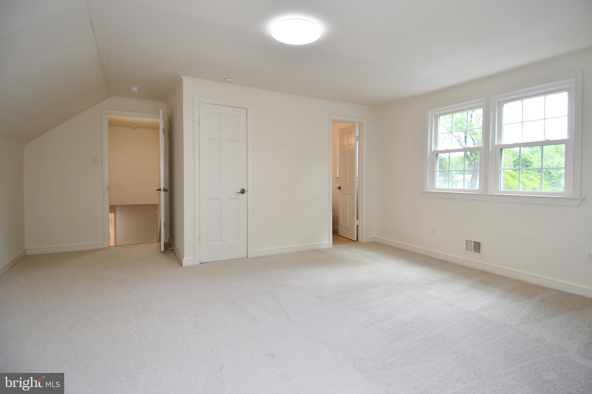 7109 Radnor Road Bethesda, MD 20817 - Photo 39 of 82 UPPER LEVEL EN-SUITE 2 CLOSET & BATHROOM DOOR