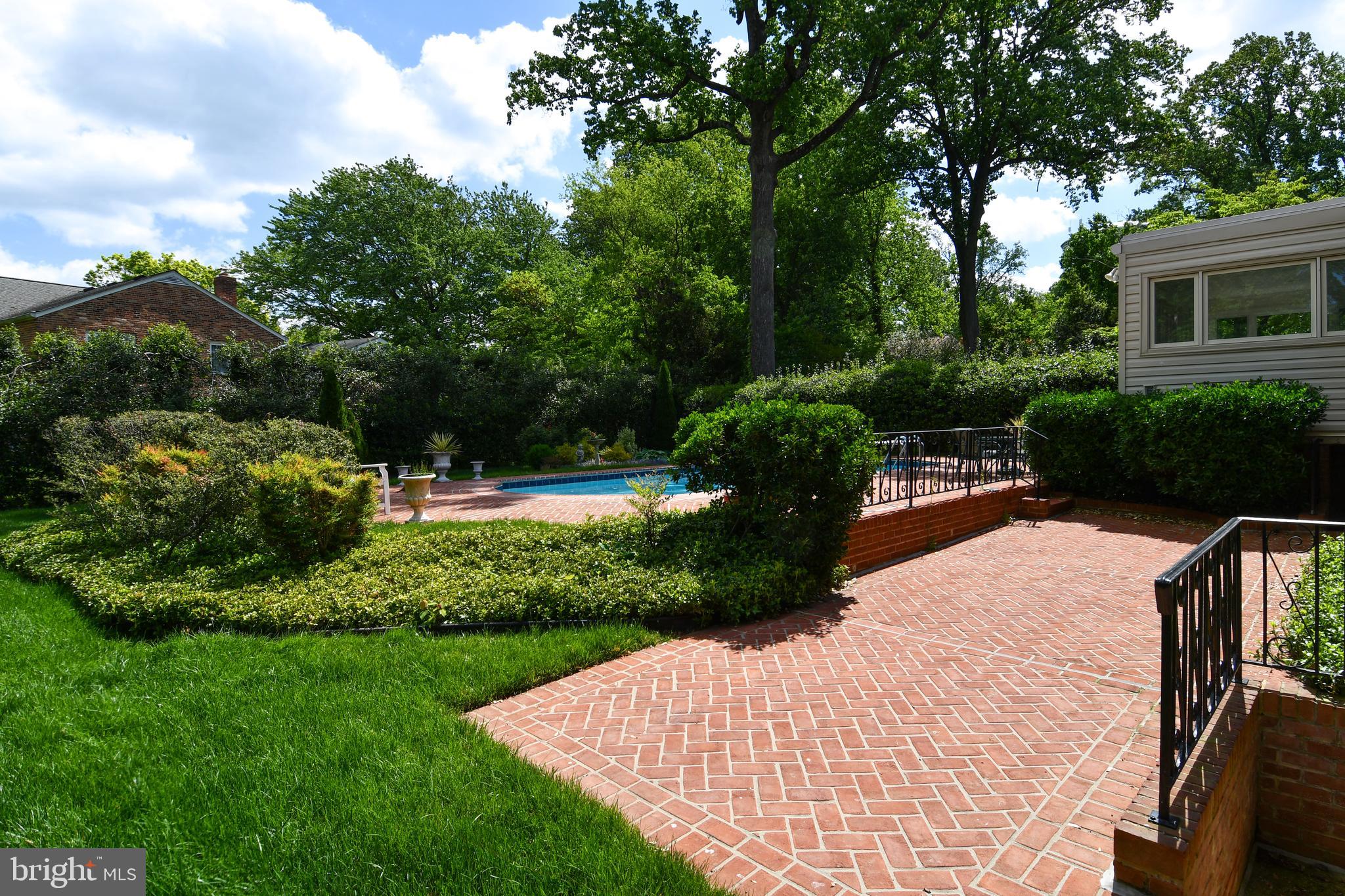 7109 Radnor Road Bethesda, MD 20817 - Photo 59 of 82 STAIRS FROM LL2 WALK UP TO HERRINGBONE BRICK PATIO