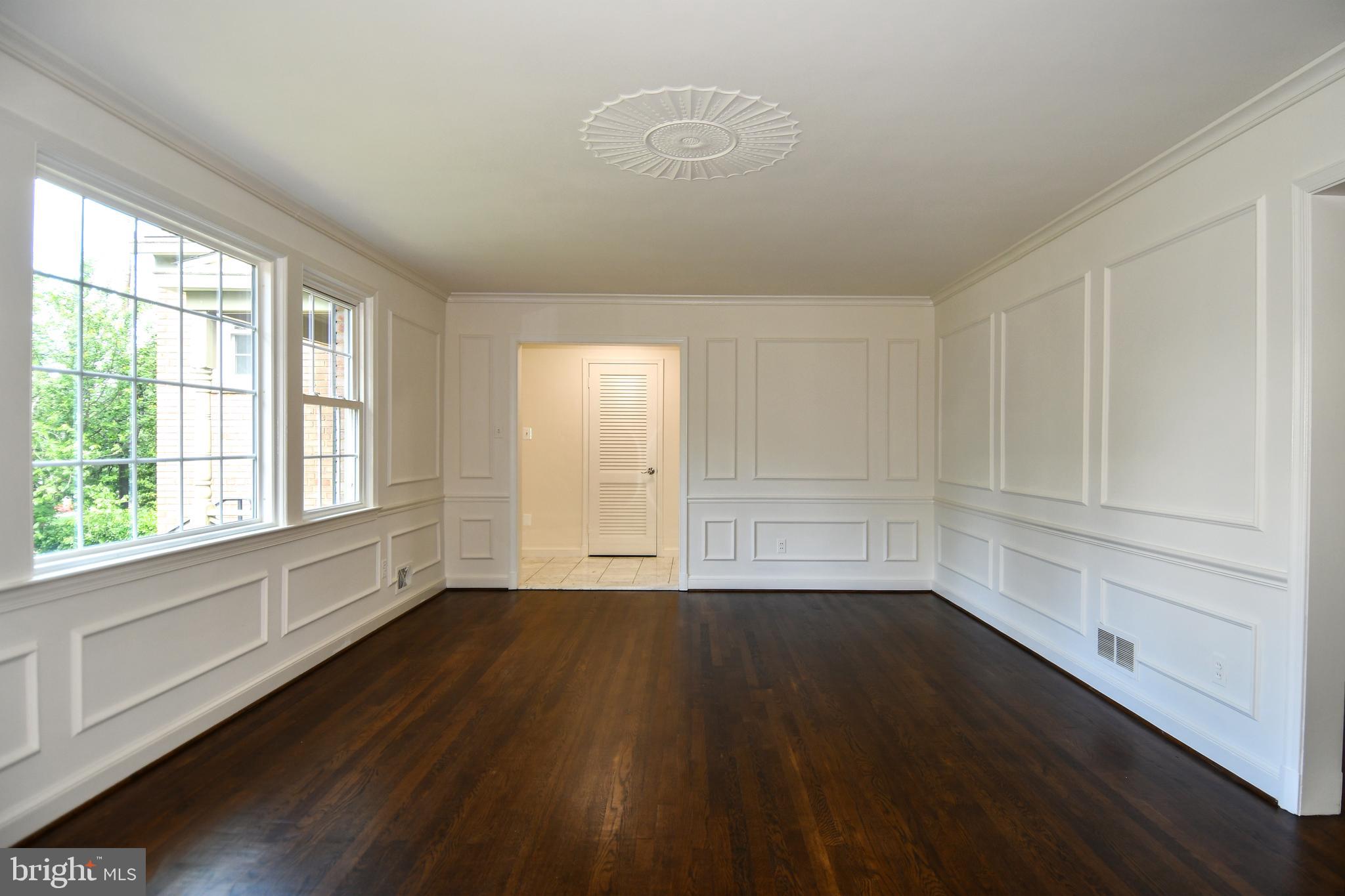7109 Radnor Road Bethesda, MD 20817 - Photo 6 of 82 MAIN LEVEL LIVING ROOM HAS WAINSCOTING