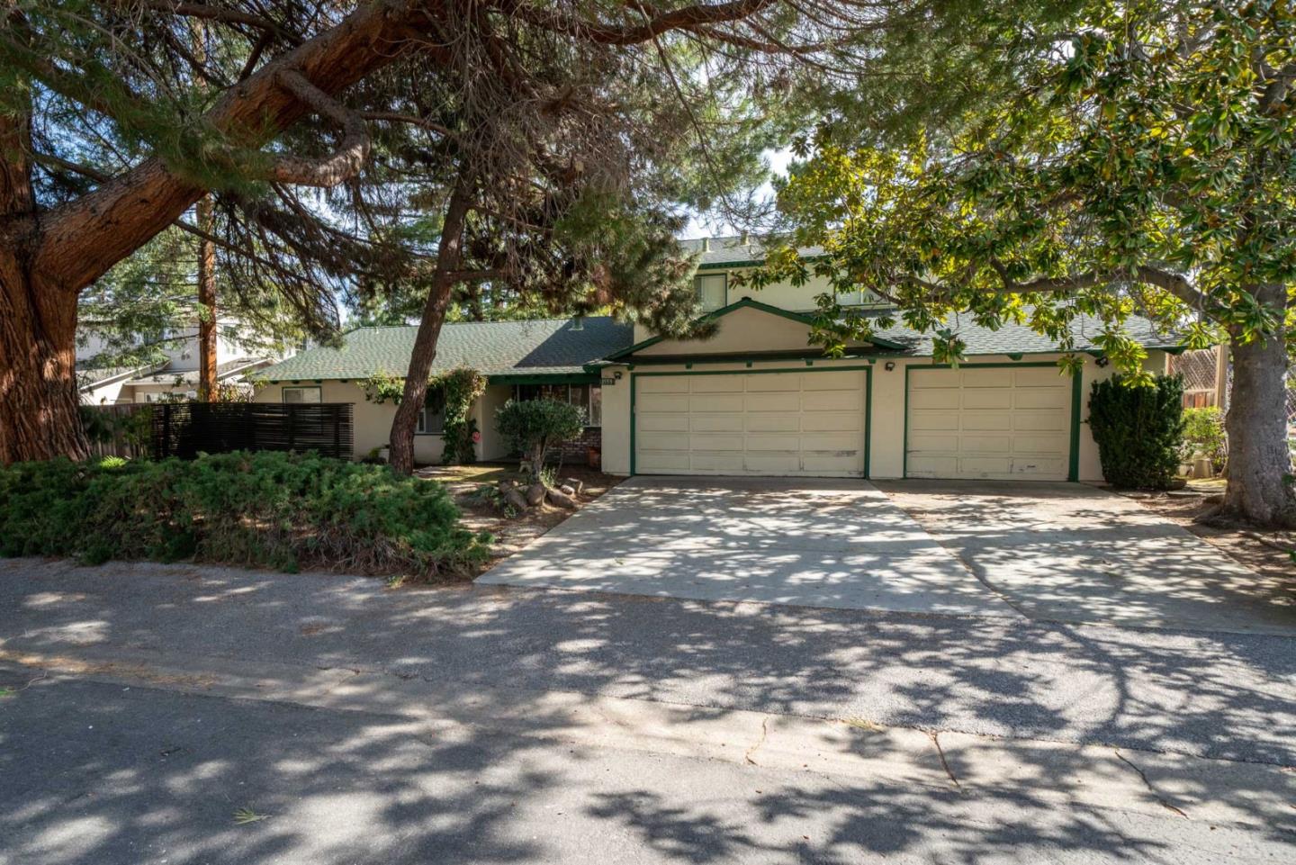1553 Meadow Lane Mountain View, CA 94040 - Photo 28 of 28 a front view of a house with a yard and garage