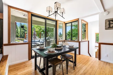 a view of a dining room with furniture window and outside view