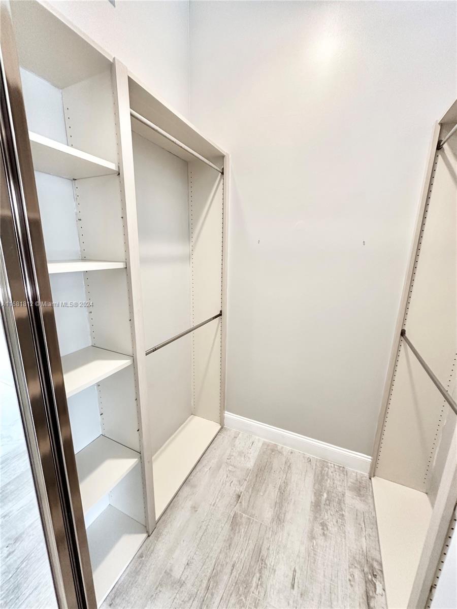 135 Hampton Circle Jupiter, FL 33458 - Photo 19 of 39 1 of 2 Primary Closets