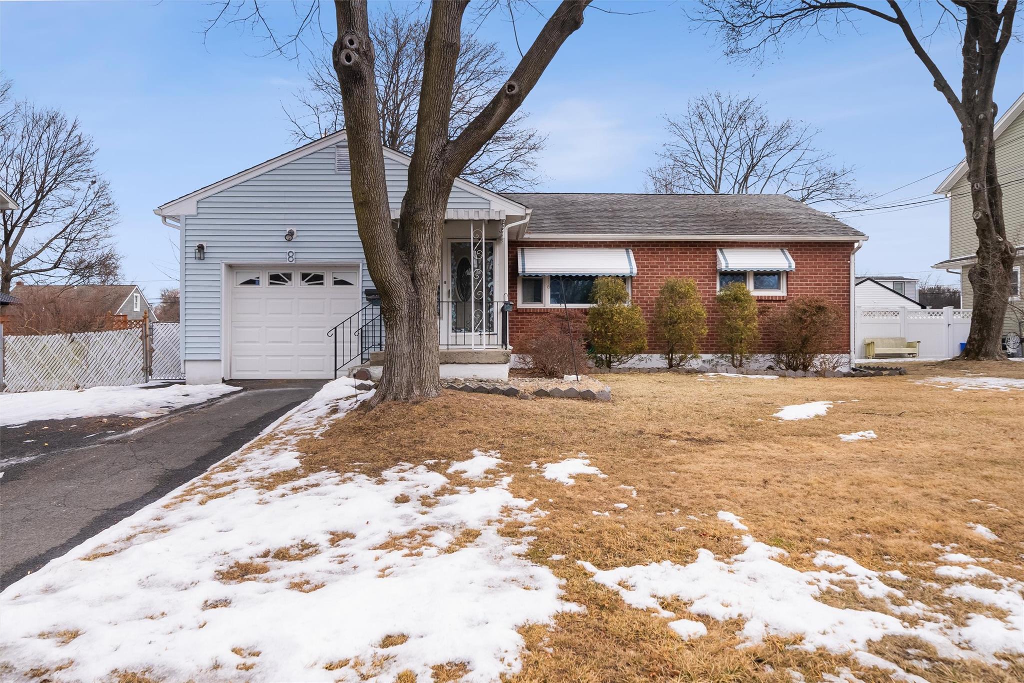 8 Lewis Road Stony Point, NY 10980 - Photo 1 of 1 Ranch-style home featuring brick siding, fence, driveway, and an attached garage