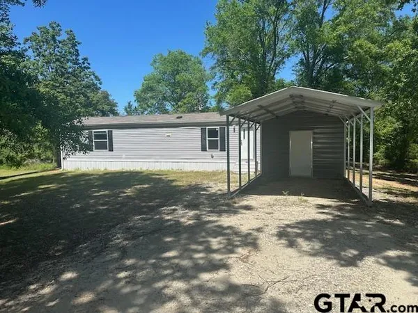 a house with yard in front of it