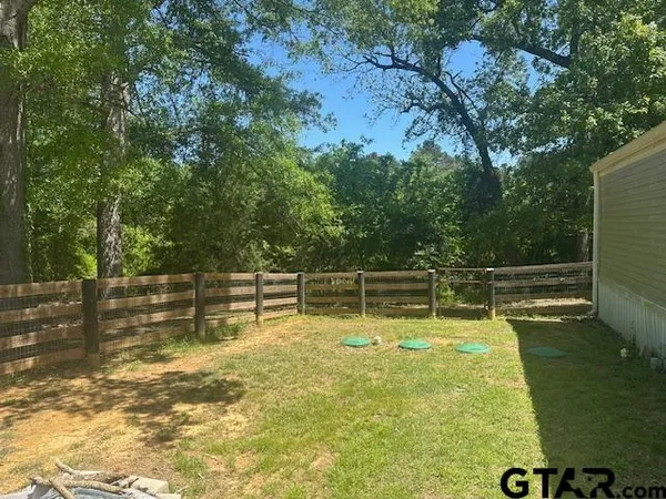 a view of a swimming pool with an outdoor seating