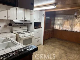 a kitchen with a stove and a refrigerator